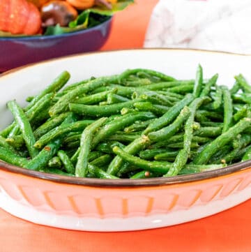 cooked green beans in a white bowl