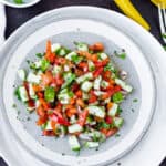 Healthy Israeli Salad in white plate