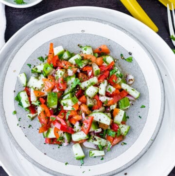 Healthy Israeli Salad in white plate