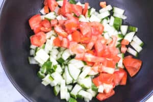 chopped salad in black bowl