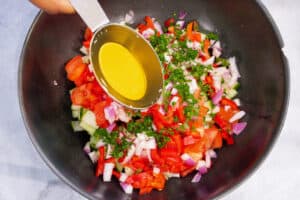 oil pouring on salad