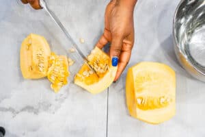 hand cutting pumpkin