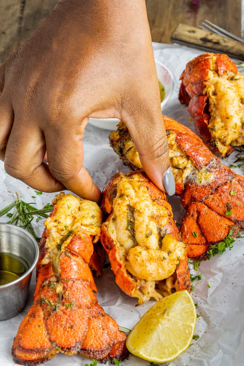 Hand holding lobster tail