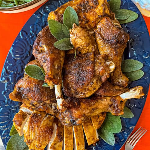 Oven roasted cajun turkey pieces on blue plate