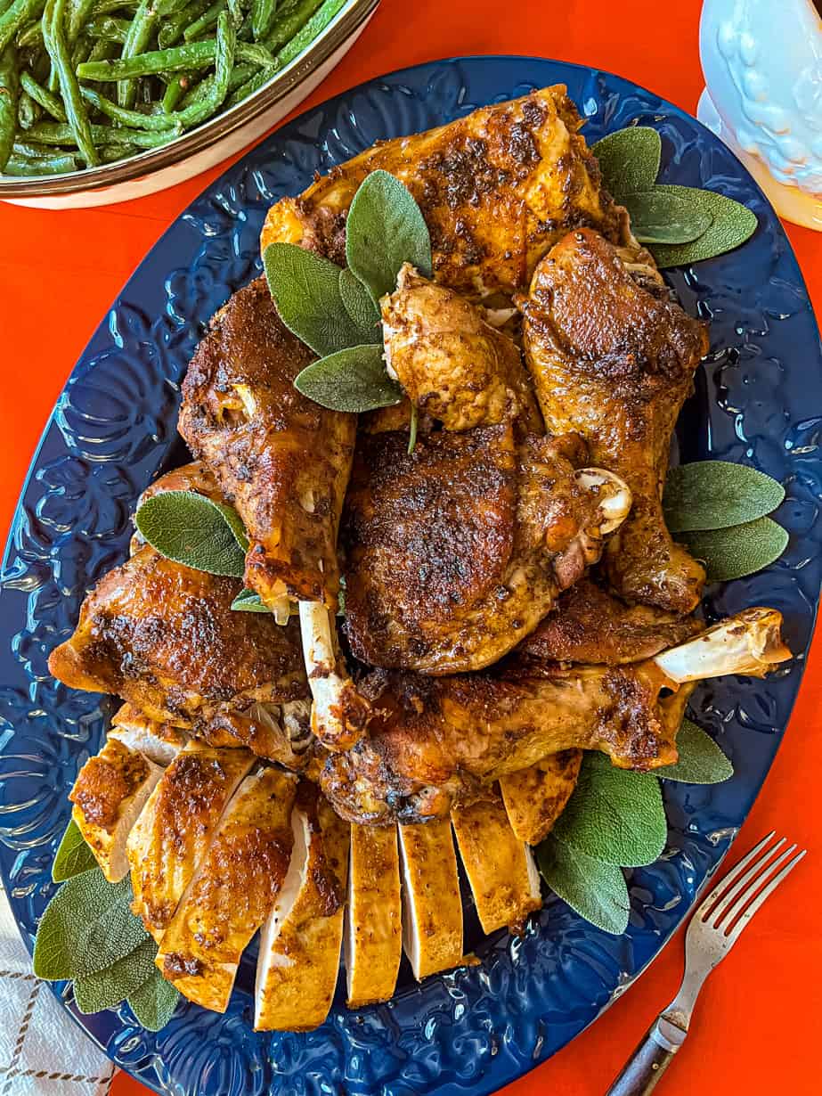 Oven roasted cajun turkey pieces on blue plate