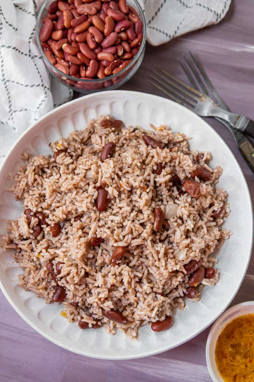 Rice beans and sauce on purple background