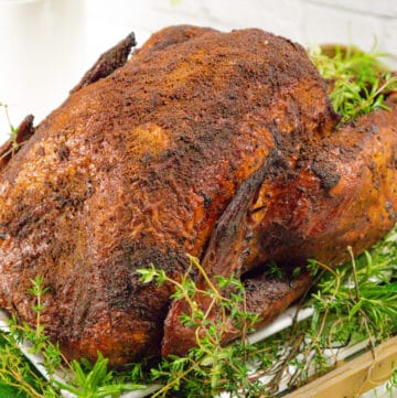 Smoked turkey on a bed of herbs