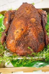 Smoked turkey on a bed of herbs