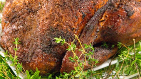 Smoked turkey on a bed of herbs