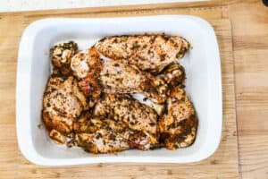 uncooked turkey wings in white baking dish