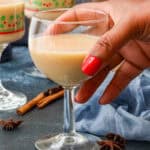 hand holding Haitian Kremas in long stem glass