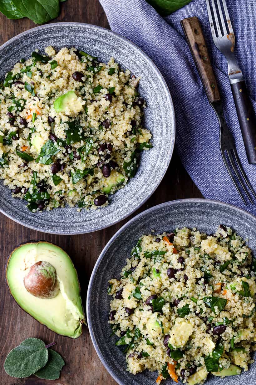 Quinoa Avocado Salad in gray bowls with avocado slices