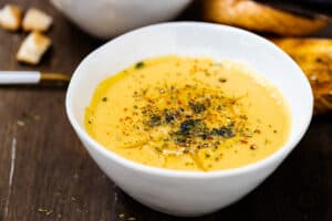 Turkish soup with red lentils in white bowl