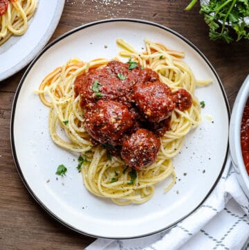 slow cooker spaghetti and meatballs on white plate