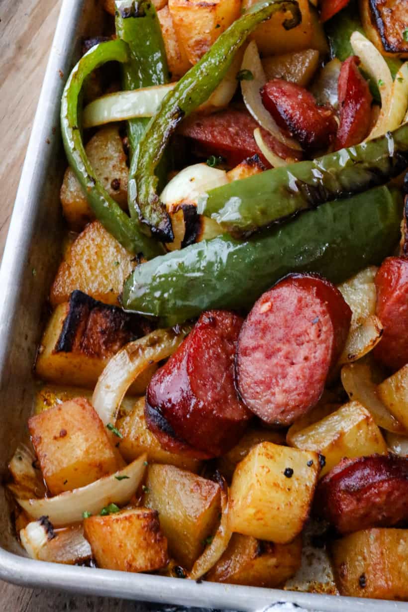 potatoes, sausage and bell peppers in tray