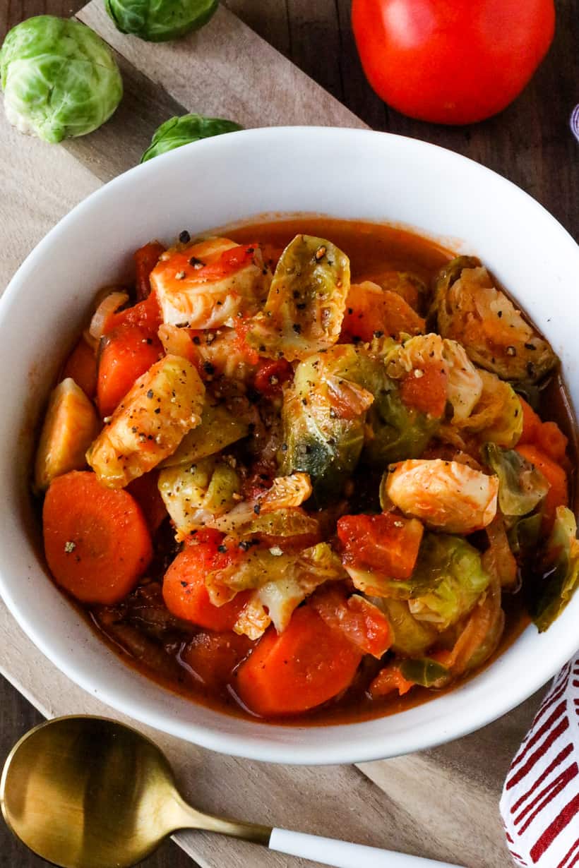 Brussels Sprouts And Carrots stew in white bowl