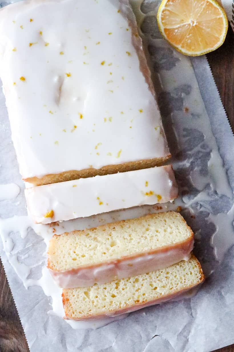 lemon loaf cake with icing and lemon