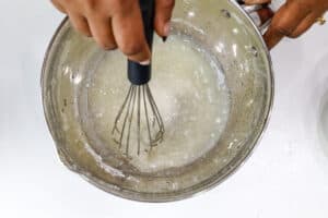 whisking lemon icing
