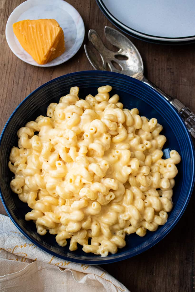 cooked stovetop Mac and cheese in blue bowl