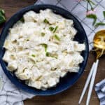 creamy potato salad in blue bowl