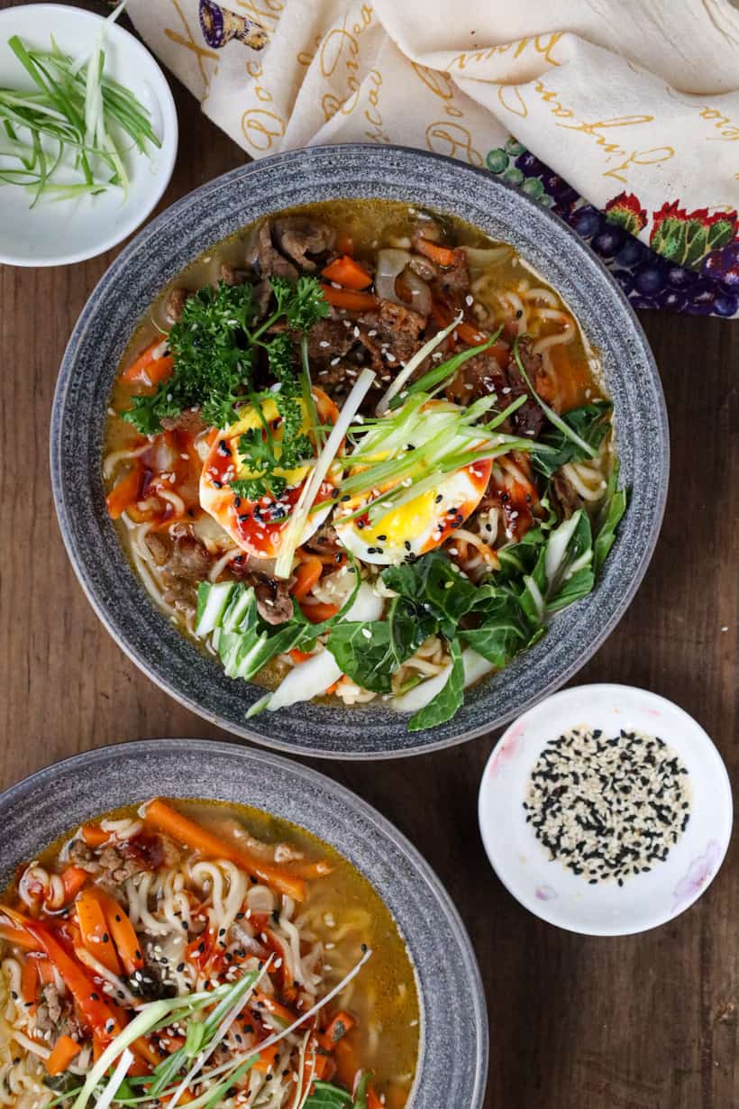 two bowls of beef ramen noodle soup