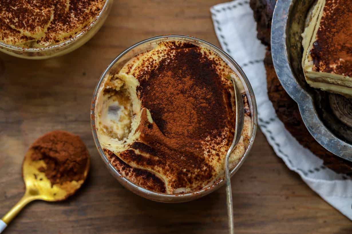 tiramisu cake cups on wooden board