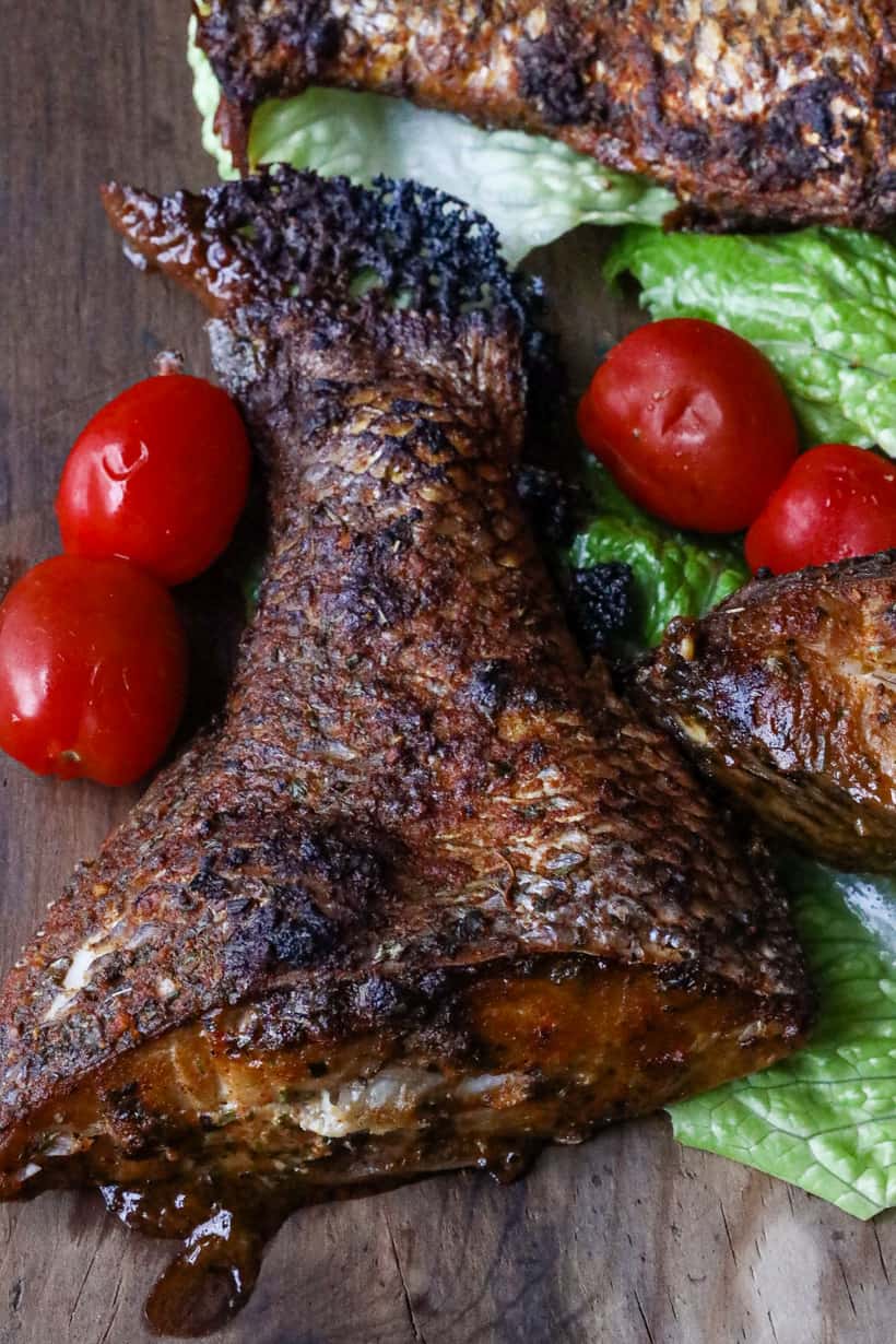 porgy fish tail on wooden board