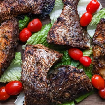 porgy fish air fried on a bed of lettuce