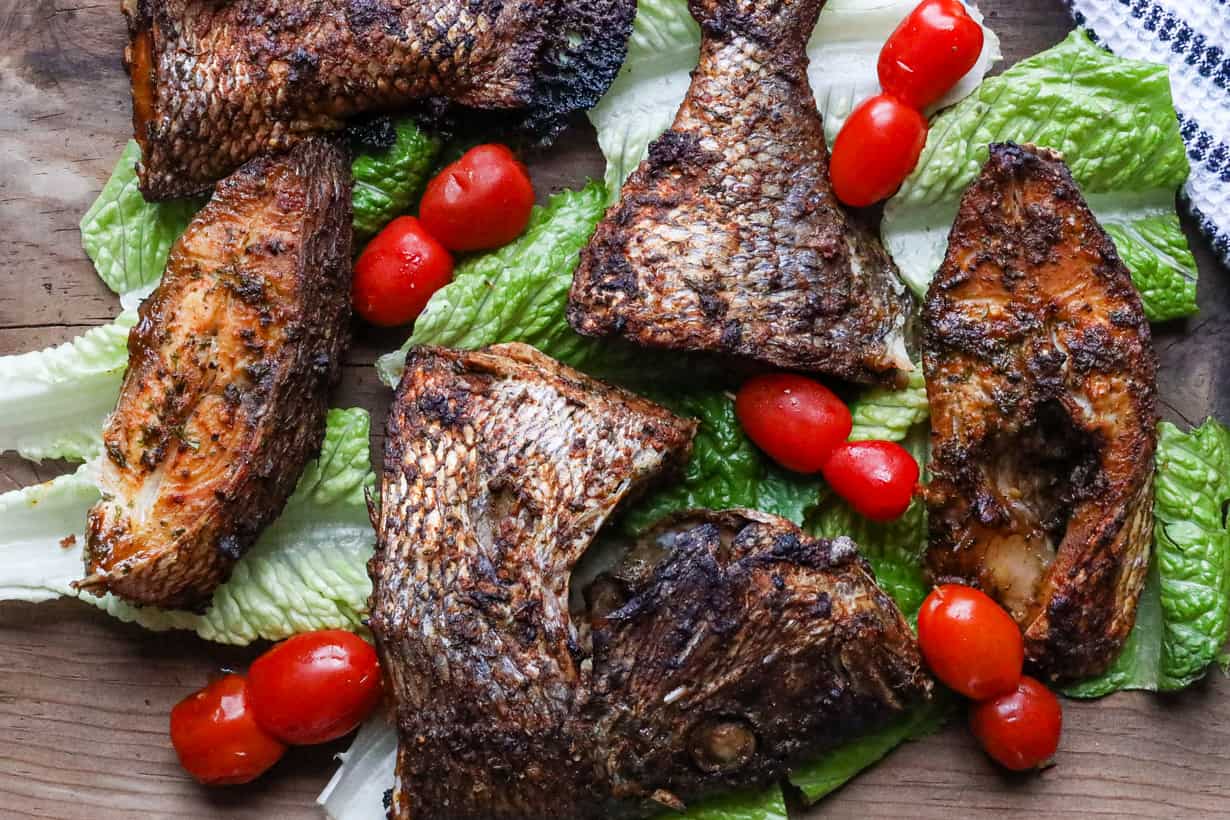 porgy fish air fried on a bed of lettuce