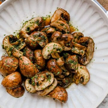 garlic mushrooms in white bowl