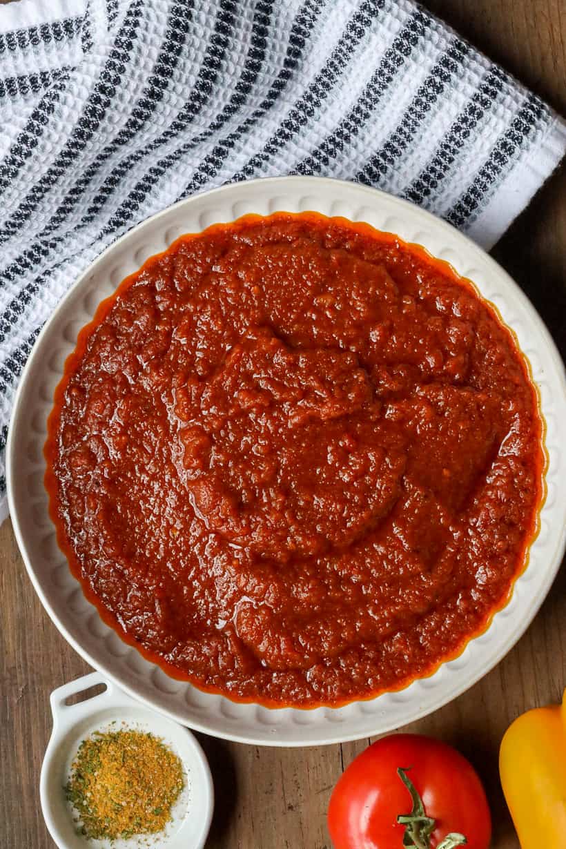 Perfectly cooked Ghanaian tomato stew in white bowl