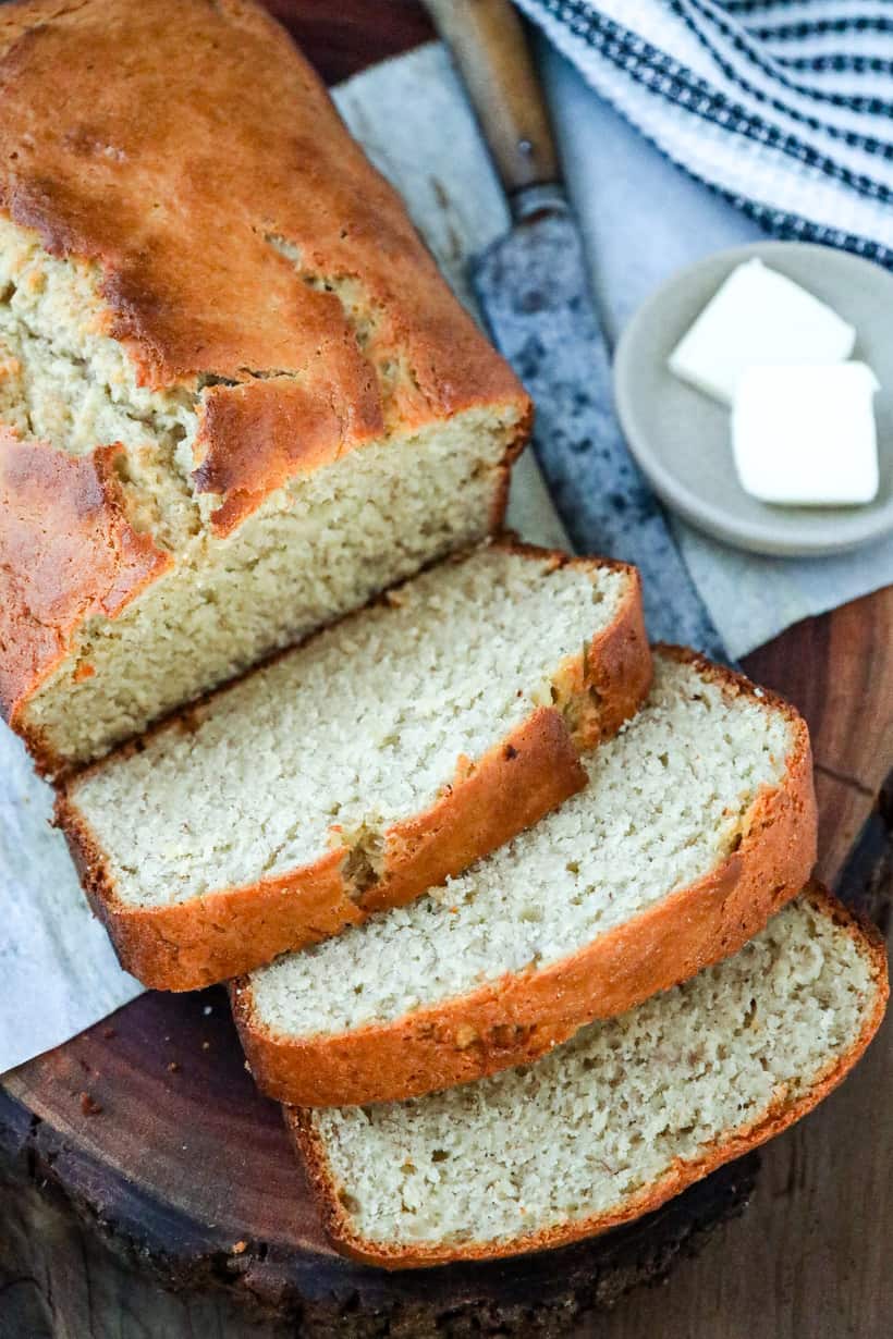 banana bread with butter on wooden board