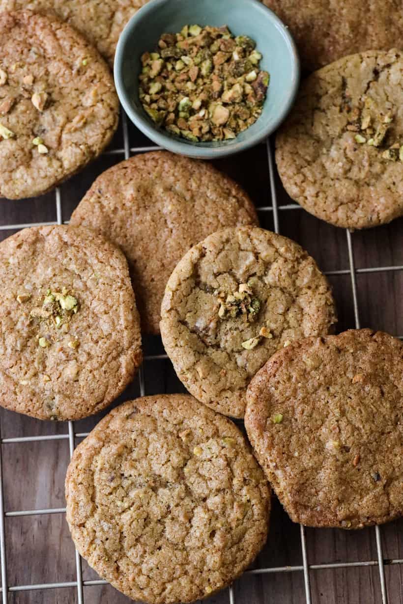 pistachio cookies and pistachio crumbs on cooling rack