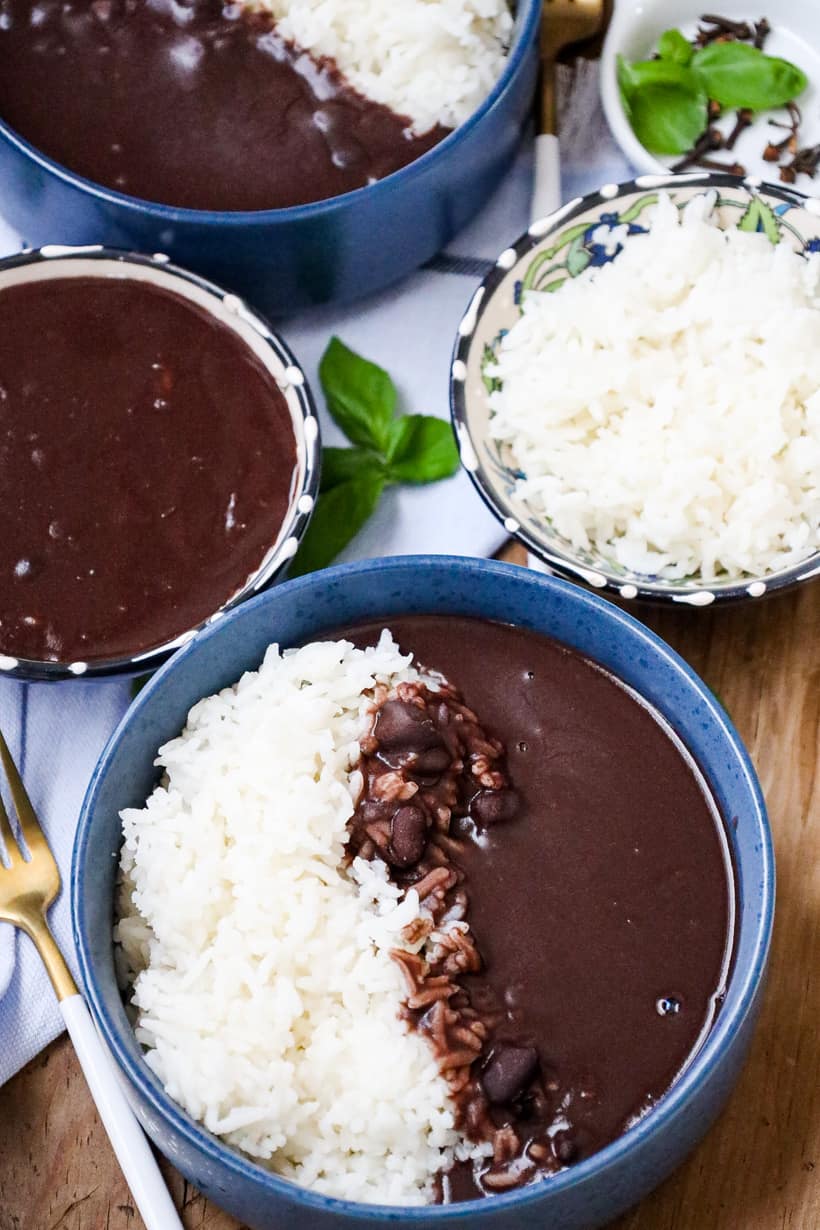 Haitian black beans sauce in bowl with white reice