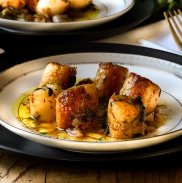 scallop provencal on plate