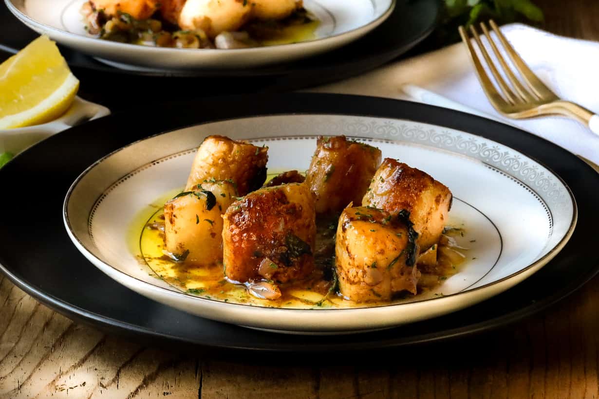 scallop provencal on plate