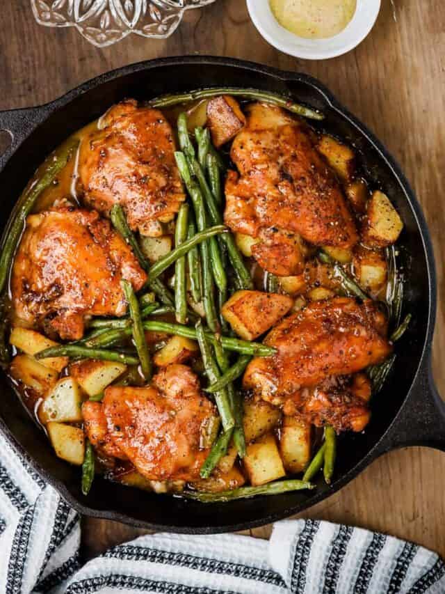 One pan honey mustard chicken, potatoes, and green beans in skillet.