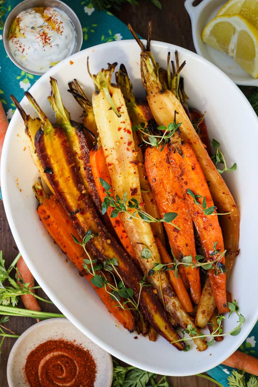 carrots in white bowl with herbs