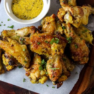 wings on board with lemon pepper and parsley flakes