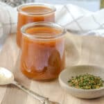 demi glace with spoon and spices in two jars