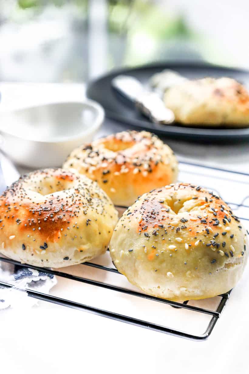 bagels topped with seeds on the rack