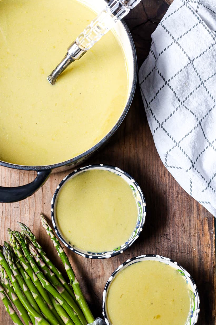 saucepan with soup and two bowls filled with soup