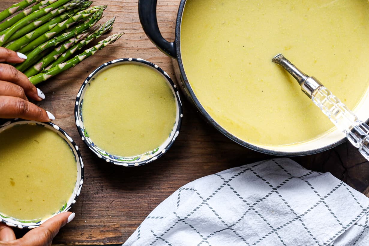 hand holding soup bowl