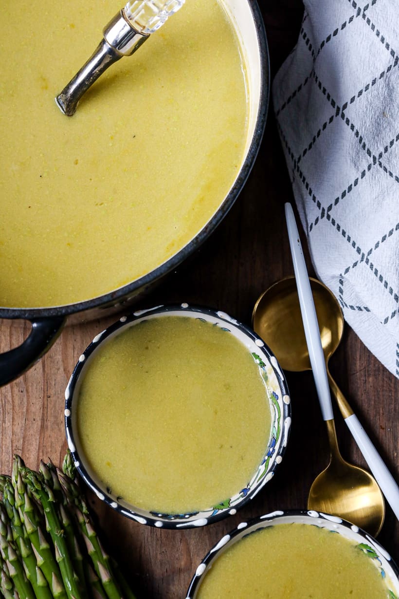 asparagus soup with spoons on the side.