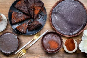 slices of Tarte Aux Chocolat on black plate