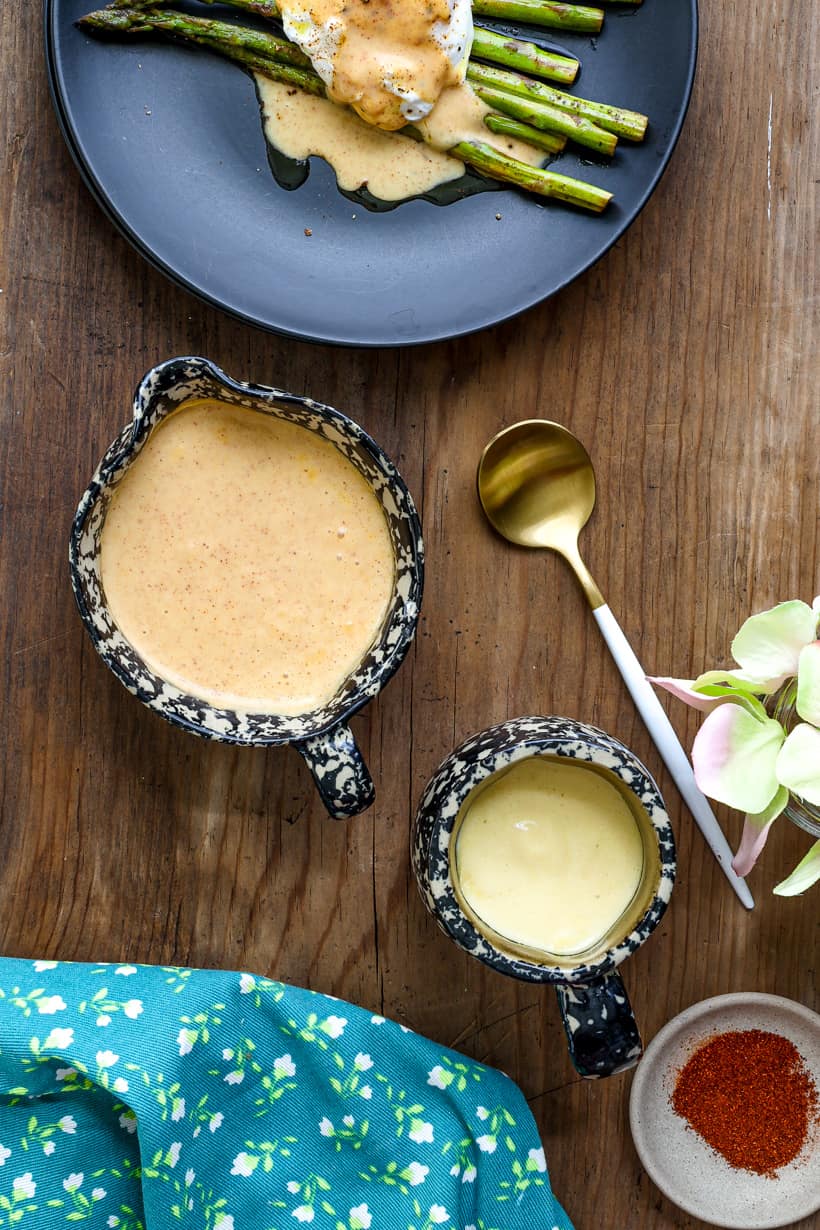 hollandaise sauce over eggs and asparagus