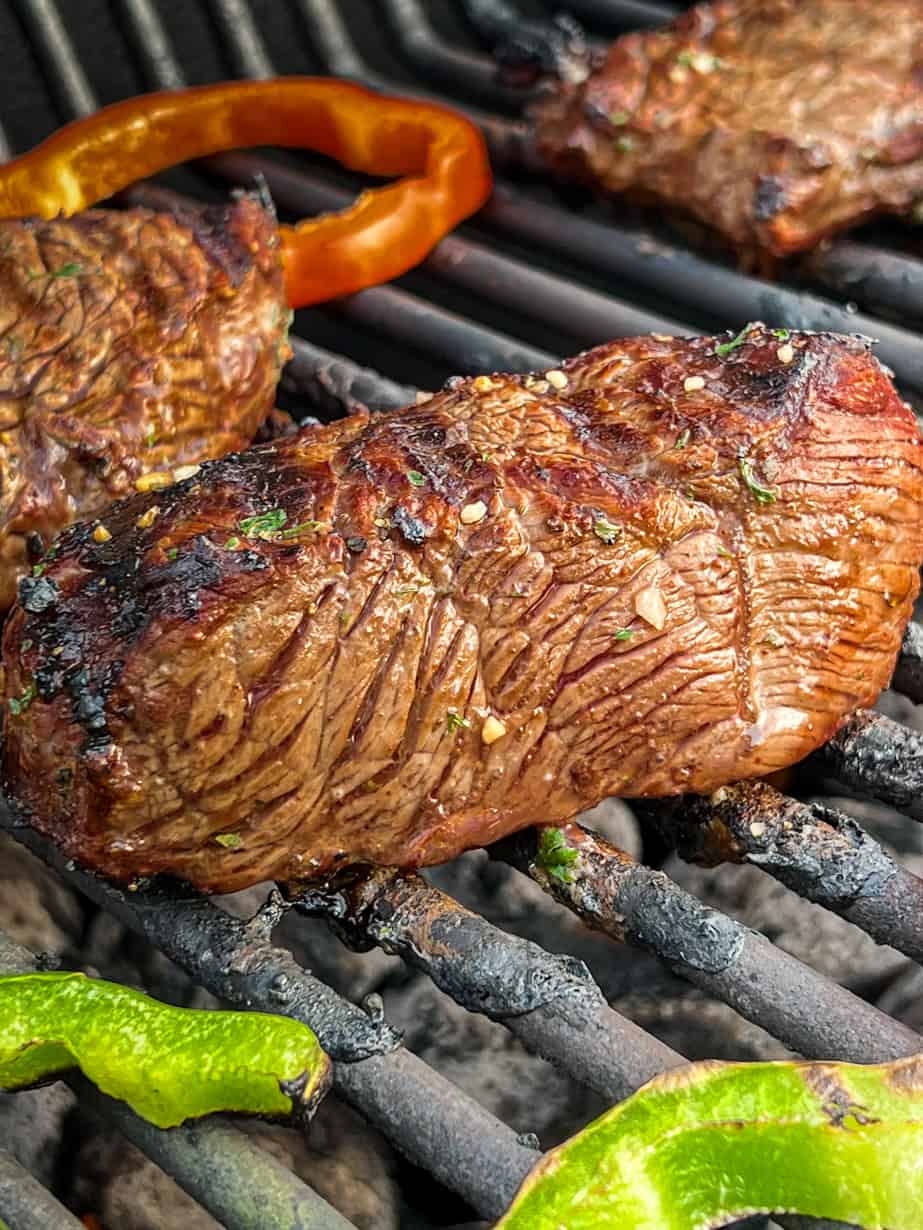 Beer marinated steak on grill