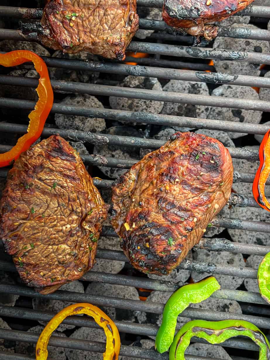 steak and peppers on the grill