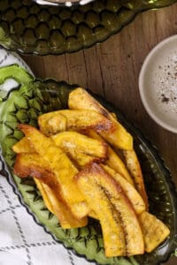 Plantain chips on green plate