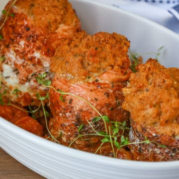 3 stuffed salmon rolls in baking dish